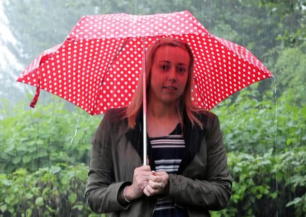Lisa Fairley endures a wet start to Wednesday after a beautiful Tuesday