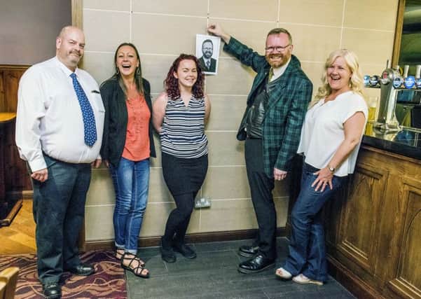 MP Martyn Day is the first to hang a photo on a new memory wall at the Earl of Zetland Pub. Picture: Chris Watt