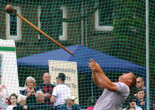 A competitor throws the light hammer at the Markinch Highland Games