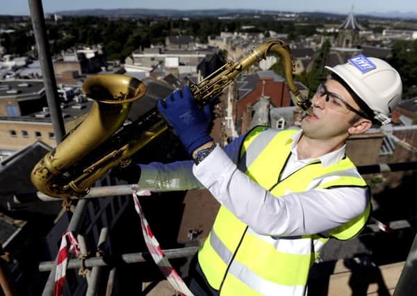 Saxophonist Konrad Wiszniewski helps launch Falkirk Live! from the top of the Steeple. Picture: Michael Gillen