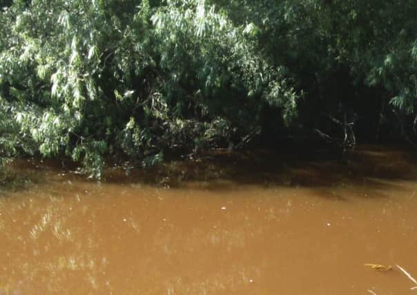 The River Carron is discoloured with iron deposits