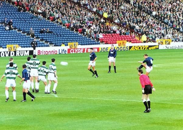 At which ground is John Clark taking a trademark free-kick?