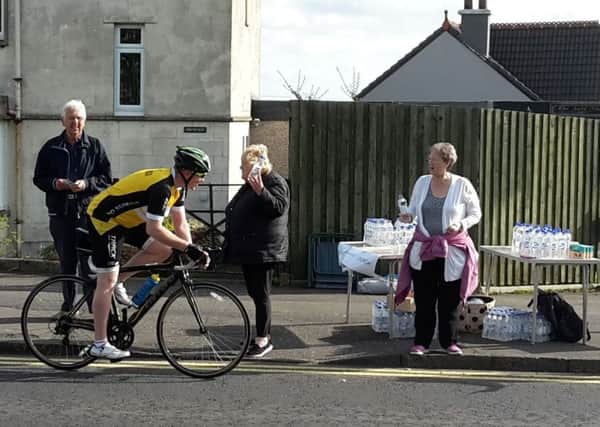 Maddiston residents hand out water to riders in the 2016 Pedal for Scotland event