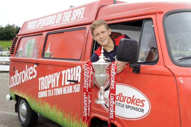 Falkirk Football Club's James Craigen with Ladbrokes Championship trophy, on tour around Scotland, stopping at The Falkirk Wheel. Picture by Michael Gillen