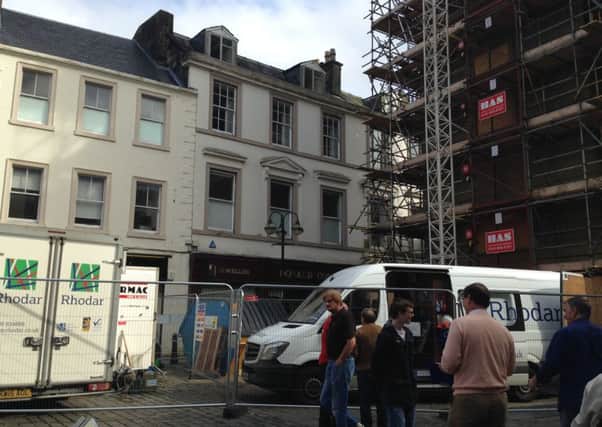 Shopkeepers and shoppers complain about the asbestos removal work being carried out at Falkirk Steeple on a Saturday