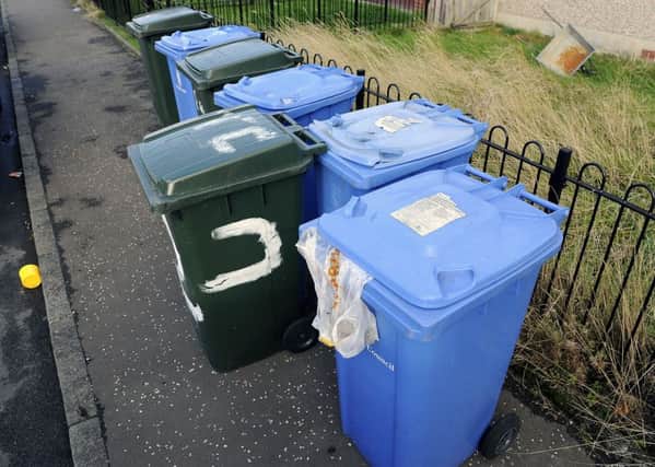 A number of bins in Langlees were not emptied as the area moved to the new collection schedule last week . Picture: Michael Gillen