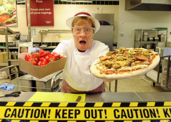 Morrison pizza maker Joan Moodie (69), from Larbert, with one the 'hotter than hell' pizzas and the fiery Naga chillies. Picture: Michael Gillen