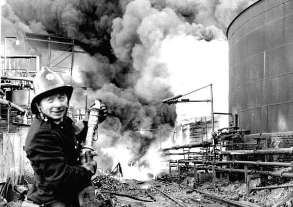 A fireman tackles the blaze at the Scottish Tar Distillers' plant at Camelon near Falkirk in November 1973