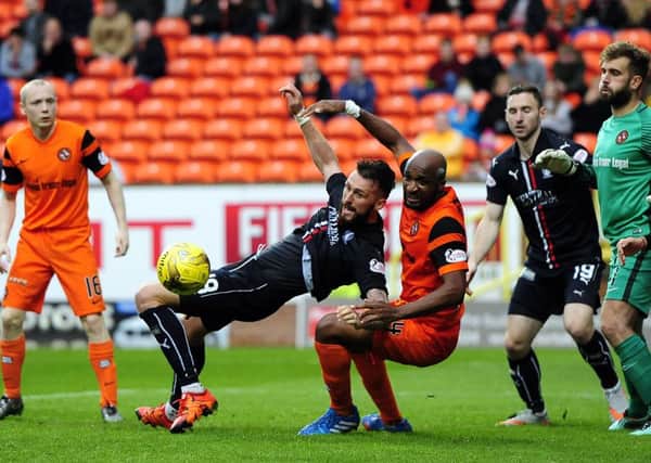 Lee Miller tries to find a way through the Dundee United defence. (pic by Michael Gillen)