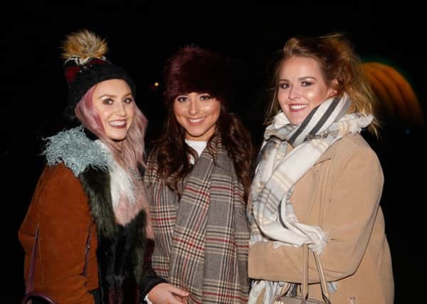 Cassie Phillips, Katie Macaulay and Emma Smith from Falkirk were well wrapped for the fireworks on Saturday. Picture: Scott Louden