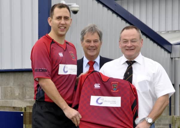 Linlithgow Rugby Club celebrate a new sponsorship deal. Left to right are   Craig Scott (captain), Ken Richardson (President) and Steve Matthews (MD Caledonian Group)