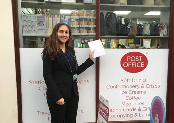 American intern Emily Porter with her vote at the Post Office in Cow Wynd