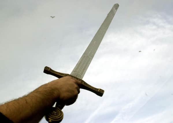 McNab waved a sword at his partner and her son