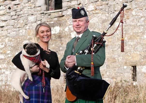 Neil Clark from Larbert and his pug are pictured with Michelle Campbell from the charity. Picture by Tina Norris