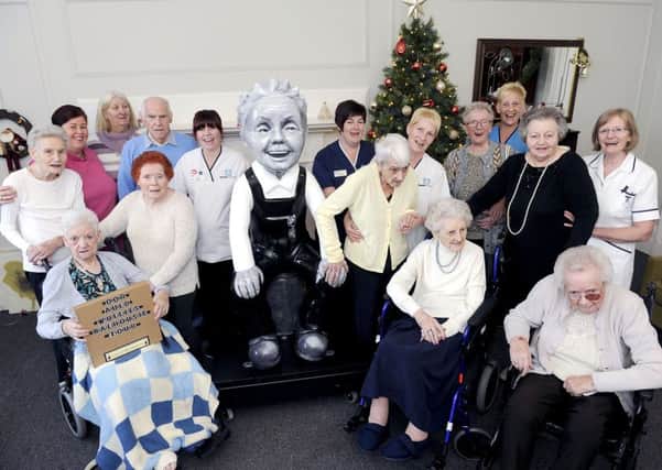 Residents and staff at Wheatlands Care Home with their Oor Wullie sculpture. Picture: Michael Gillen