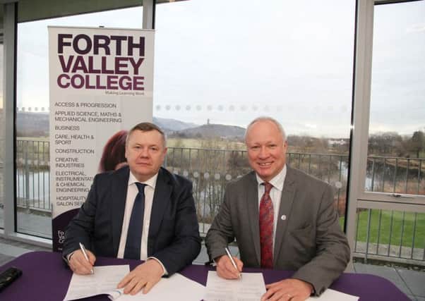 Pic Sibur 5: Victor Kuklinov Adviser to Chief Operating Officer of SIBUR at their HQ in Moscow signs the MoU with FVC Principal Dr Ken Thomson at the Stirling Campus.