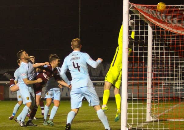 David Marsh gets a header in against Livingston but his effort went over the bar.