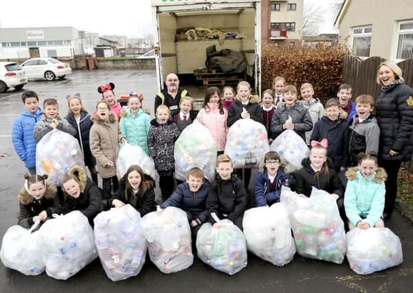 Sacred Heart pupils hand over their bottle collection