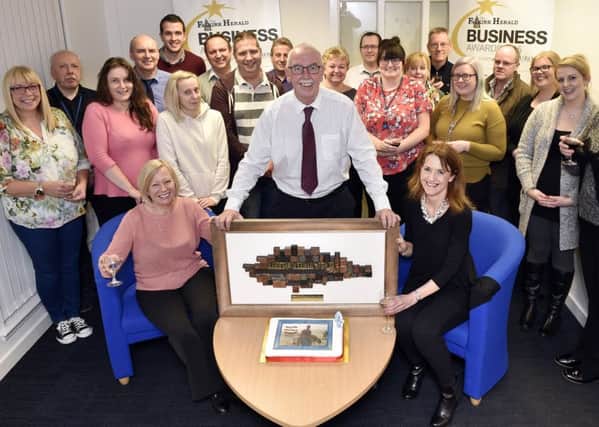Douglas celebrates his 50 years at the Falkirk Herald with colleagues