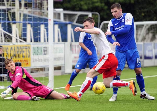 Robbie Thomson in action for Queen of the South against Falkirk. Pic by Michael Gillen