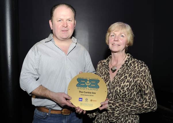 Corbie Inn owners Gail and Giles Fairholm with their gold award
Picture: Michael Gillen