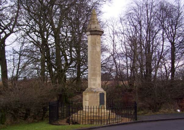 The battle monument erected in 1927 and (below) the Redcoat Dragoons face the highland clansmen.
