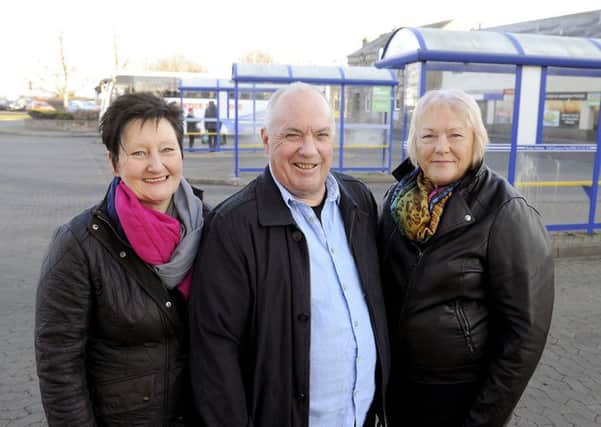 Rab Jeffrey with wife Helen, right and volunteer Rhona Lapsley. Picture: Michael Gillen