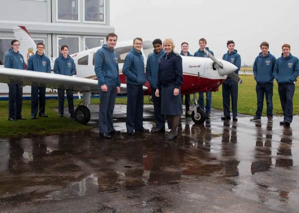 Pictured: Air Commodore Dawn McCafferty (front row right), Commandant Air Cadets, with participants at the launch of the Flying Aces Project at Tayside Aviation Dundee.

AIR CADETS FLYING ACES SCHEME LAUNCH EVENT, SATURDAY 28 JANUARY 2017 TAYSIDE AVIATION, DUNDEE AIRPORT
The Scotland & Northern Ireland Region Air Cadets Flying Aces Scheme Launch Event will take place on Saturday 28th January 2017 at Tayside Aviation, Dundee, and will be attended by Air Officer Scotland, Air Vice-Marshal Ross Paterson CB OBE ADC, Commandant Air Cadets, Air Commodore Dawn McCafferty, together with a range of other dignitaries, key benefactors and guests. 
Flying Aces has 2 elements which are: -
THE FLYING ACES SCHEME  ENHANCING THE AIR CADETS FLYING EXPERIENCE

This is designed to provide air experience flying and future career pathway opportunities for Air Cadets of all backgrounds, recognising that every young person, regardless of class, family background or circumstances, should be afforded this opportunity.  Air exp