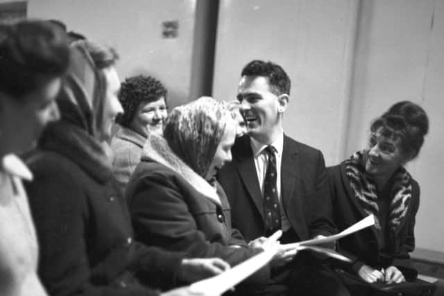 A young Tam Dalyell enjoys a joke with his supporters before his debate with William Wolfe, the prospective SNP MP in February 1966 - debate took place in Linlithgow Town Hall