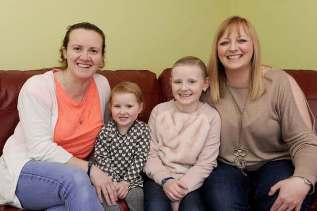 Mums Elaine McDowall and Lisa Easton with their beloved daughters Hollie and Ashlee. Picture: Michael Gillen