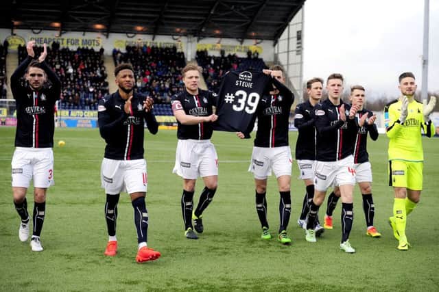 Falkirk players made a pre-match tribute to fan Stevie Black who died this week. Pic by Michael Gillen