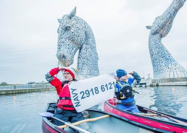 Members of the Stirling & Falkirk Canoe Club search for the winner at the Kelpies. Picture: Alan Peebles