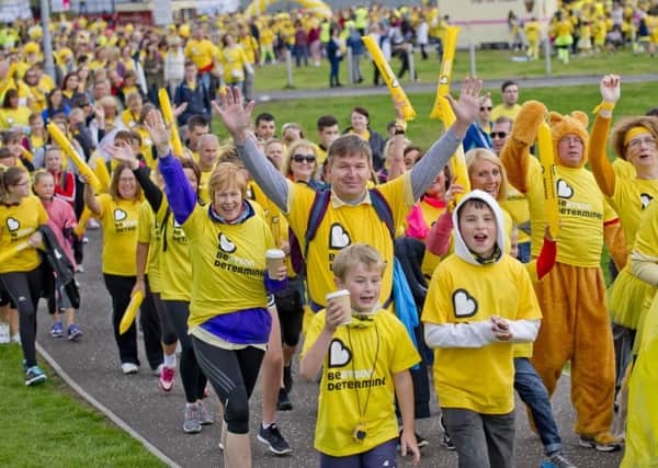 A sea of yellow ready to walk through Glasgow to raise money for the Cancer Charity.   Photograph by Alan Peebles