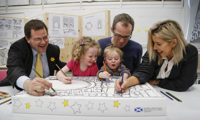 From left: Minister for Childcare Mark McDonald, Mona and Magnus with dad Patrick and Leanne Young.