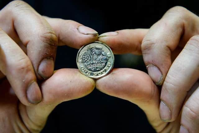 The new Â£1 coin is being produced at the Royal Mint in Llantrisant, South Wales.