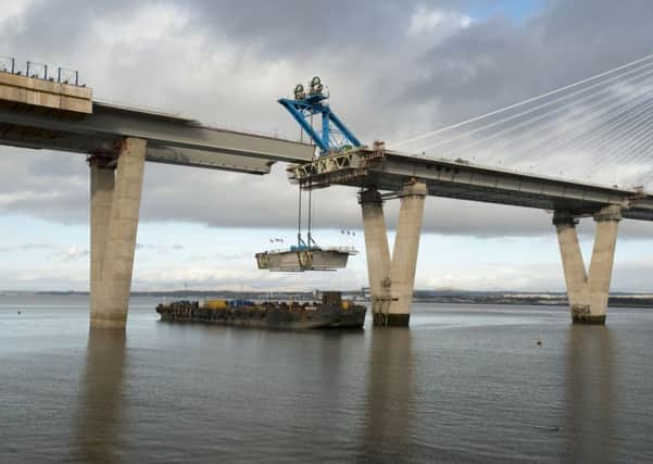The final part of the bridge is lifted into place