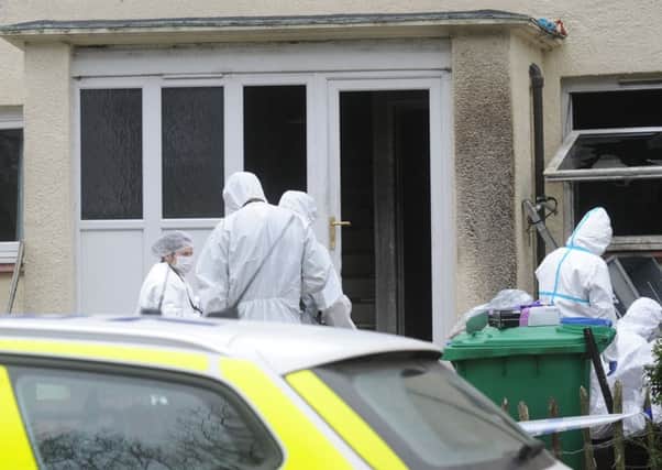 Forensic officers at the scene of the fire at Adrian Road, Glenrothes