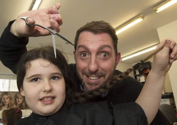 Lily prepares for the chop as hairdresser Scott Penn moves in for the big charity cut
