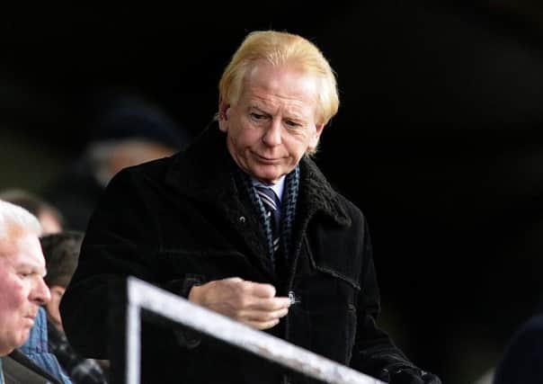 Falkirk chairman Doug Henderson has faced calls to resign from fans over his political statement published in the club programme and website.