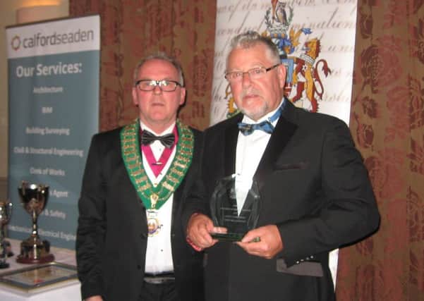 Terry (pictured right) with his award