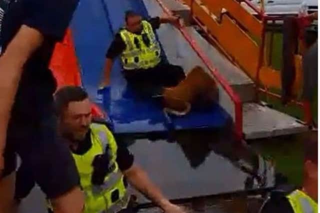 The three officers reach the bottom of the slide. Video: Brian Kerr