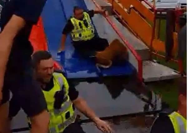 The three officers reach the bottom of the slide. Video: Brian Kerr
