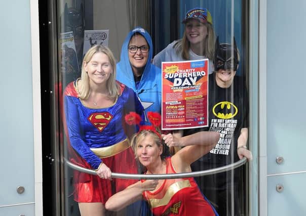 The Howgate team get ready for the superhero day this Saturday, June 3 by trying out their costumes. Picture: Michael Gillen