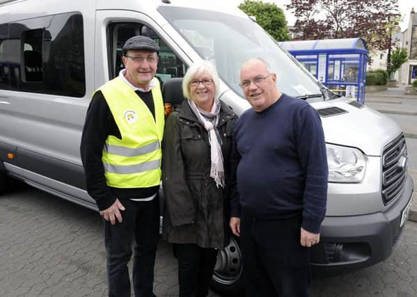 Driver Graeme Turton, committee member, Marion Hunter and secretary Rab Jeffrey of the Bo'ness and Area Community Bus Association. Picture: Michael Gillen