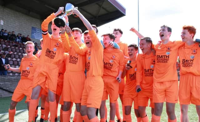 Syngenta under-16s lifted the Central Region Cup, and brought on long-term injury victim to join the celebrations.