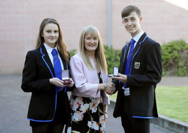 Headteacher Lesley Carroll with Proxime Accessit Eilidh Hunter and Dux Conor Whitehead