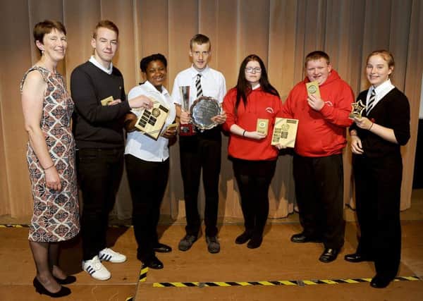 (L-R) Gillian Robertson, head teacher; Craig Cook, House Pupil of the Year Bruce House; Mercy Fasoro, House Pupil of the Year Bruce House; Barry Ferguson, Kenneth Buckley Award for Sporting Achievement; Nicole Redding, House Pupil of the Year Wallace House; Aaron Kilgour, House Pupil of the Year Wallace House and Hannah Craig,Outstanding Achievement in Drama. Picture: Michael Gillen