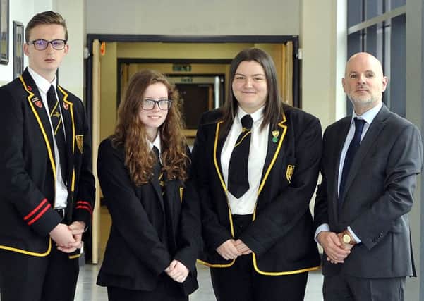 Grangemouth High School head teacher Paul Dunn with dux for 2017 Morgan Reid, second from right, and joint proxime accessits Alan Dick and Megan Randalls