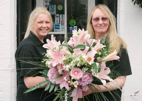 Ann Baff Flowers display supports a new cervical cancer screening campaign