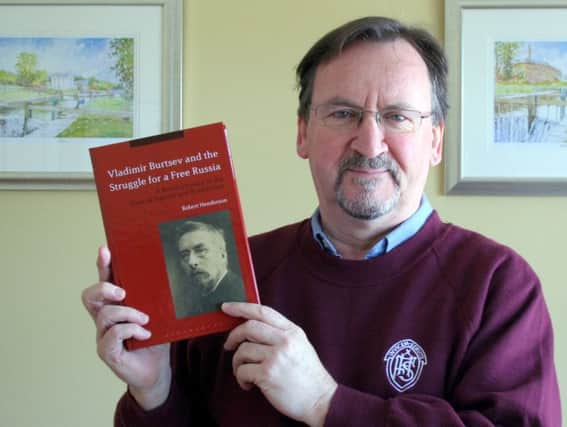 Robert Henderson with his new book